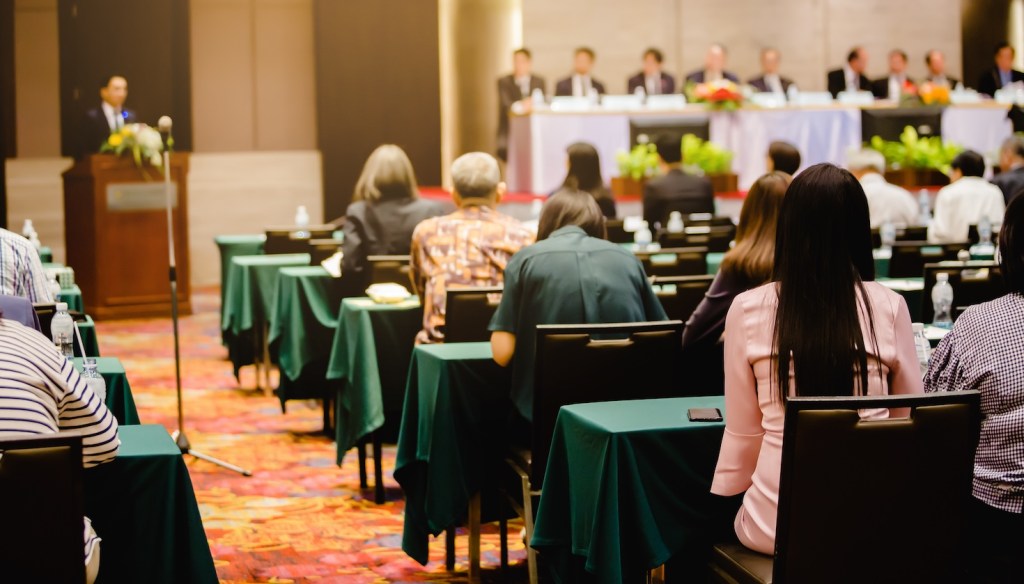 A stock photograph of a shareholder meeting